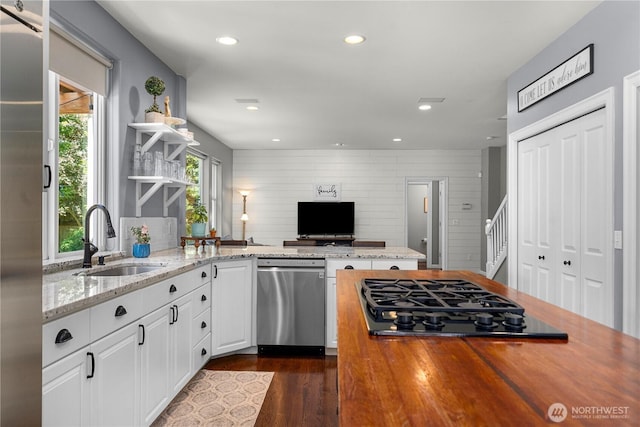 5625 Elizabeth Ave SE, Auburn, WA 98092 - kitchen with stainless steel appliances, open shelves, wooden counters, white cabinetry, and recessed lighting