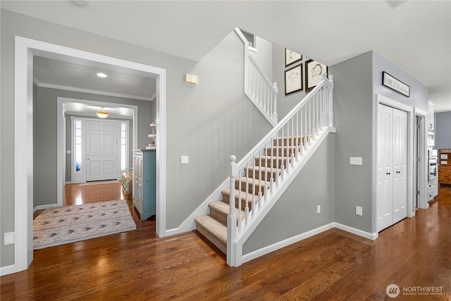 5625 Elizabeth Ave SE, Auburn, WA 98092 - entryway featuring stairs, wood finished floors, and ornamental molding