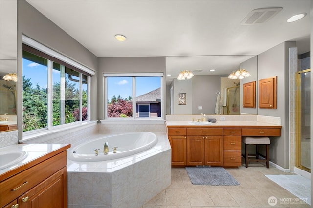 5625 Elizabeth Ave SE, Auburn, WA 98092 - full bathroom with two vanities, a bath, a stall shower, and tile patterned flooring