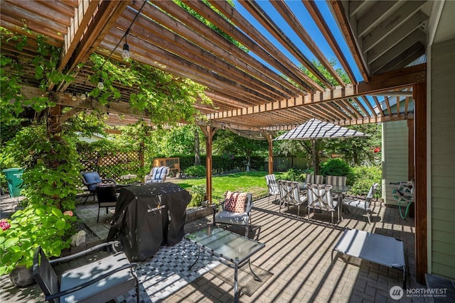 5625 Elizabeth Ave SE, Auburn, WA 98092 - fenced backyard featuring outdoor dining space, a pergola, area for grilling, and a patio area