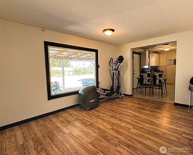 616 S Ironwood, Moses Lake, WA 98837 - workout area featuring wood finished floors and a textured ceiling