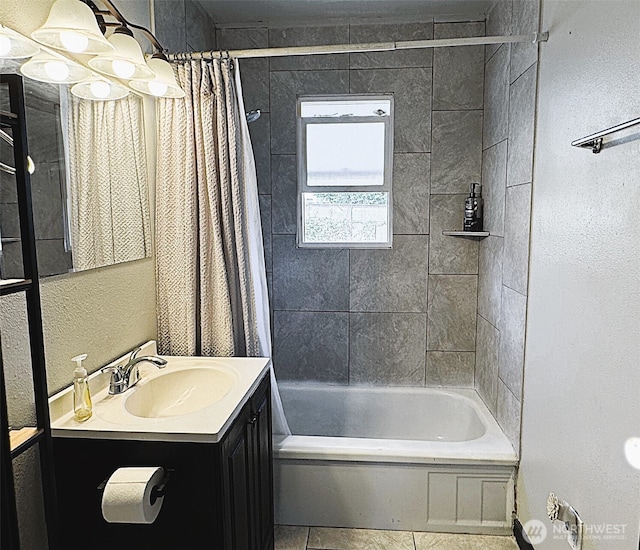 616 S Ironwood, Moses Lake, WA 98837 - bathroom featuring vanity, shower / bath combo with shower curtain, and a textured wall