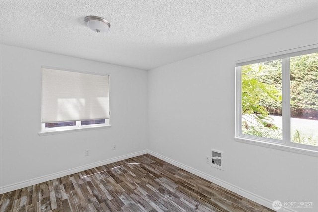 6426 Zangle Rd NE, Olympia, WA 98506 - unfurnished room featuring dark wood-style flooring and a textured ceiling