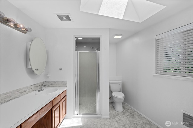 6426 Zangle Rd NE, Olympia, WA 98506 - bathroom featuring a skylight, vanity, and a shower stall