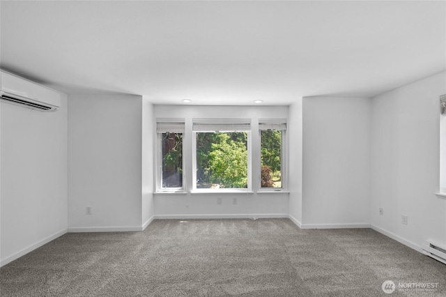 6426 Zangle Rd NE, Olympia, WA 98506 - carpeted empty room with a wall mounted air conditioner and a baseboard radiator