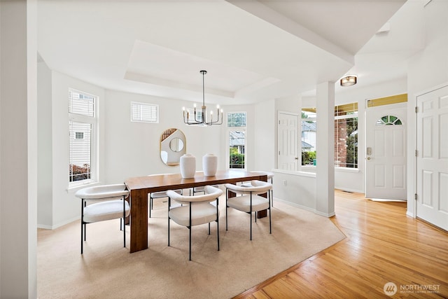 18353 160th Pl SE, Renton, WA 98058 - dining area featuring a chandelier, light wood-style floors, and a tray ceiling