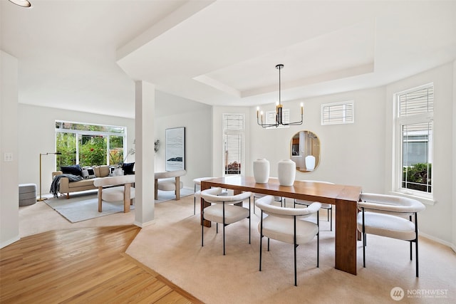 18353 160th Pl SE, Renton, WA 98058 - dining space featuring a tray ceiling, light wood-style flooring, and a chandelier
