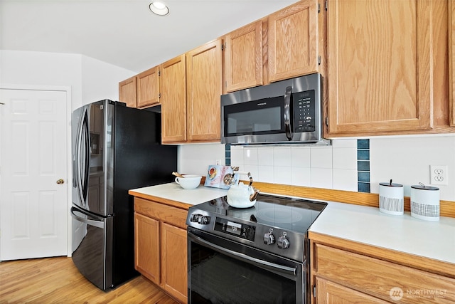 18353 160th Pl SE, Renton, WA 98058 - kitchen featuring stainless steel microwave, electric range, light countertops, freestanding refrigerator, and recessed lighting