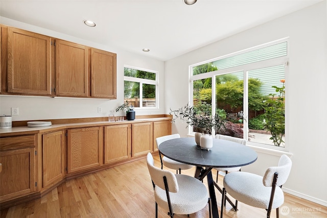 18353 160th Pl SE, Renton, WA 98058 - kitchen featuring light wood finished floors, recessed lighting, brown cabinets, and light countertops