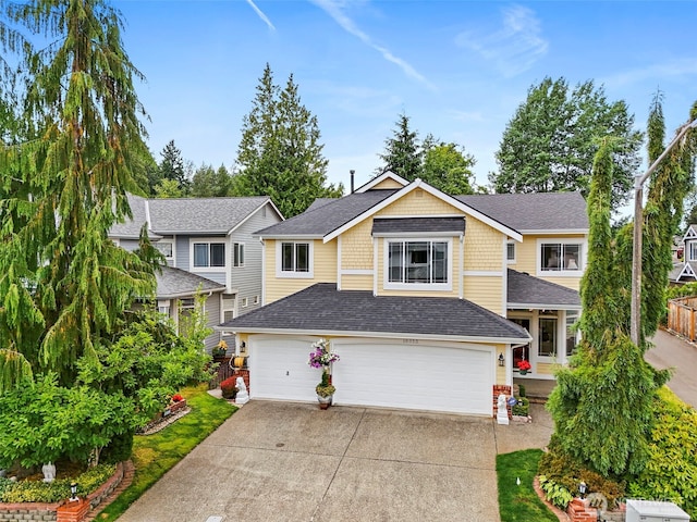 18353 160th Pl SE, Renton, WA 98058 - view of front of home featuring concrete driveway, a garage, and a shingled roof