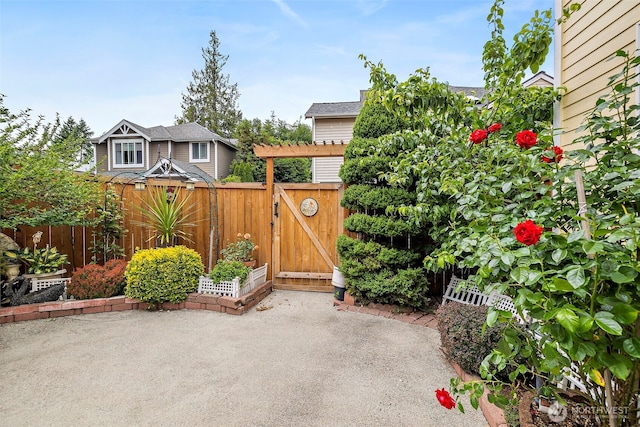 18353 160th Pl SE, Renton, WA 98058 - fenced backyard with a patio and a gate