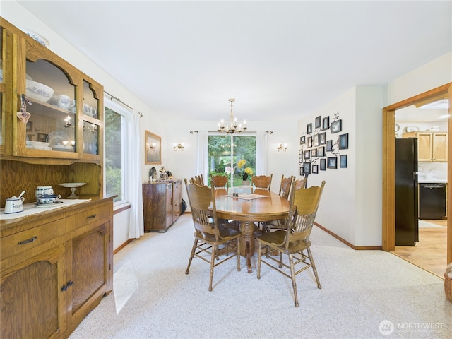 27014 80th St E, Buckley, WA 98321 - dining space featuring a chandelier and light colored carpet