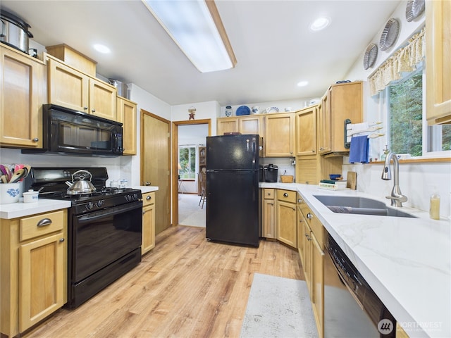 27014 80th St E, Buckley, WA 98321 - kitchen featuring black appliances, light wood finished floors, recessed lighting, light stone countertops, and light brown cabinets