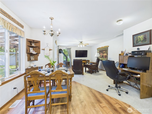 27014 80th St E, Buckley, WA 98321 - dining space with plenty of natural light, a desk, wood finished floors, and a ceiling fan