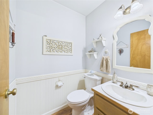 27014 80th St E, Buckley, WA 98321 - half bath with wainscoting, vanity, and wood finished floors