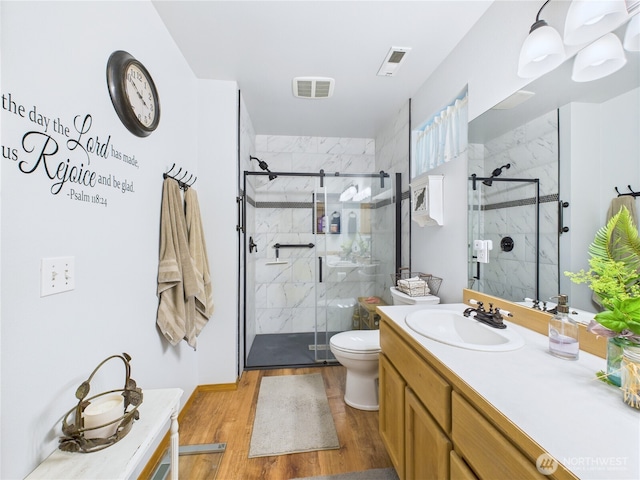 27014 80th St E, Buckley, WA 98321 - bathroom featuring vanity, a marble finish shower, and wood finished floors