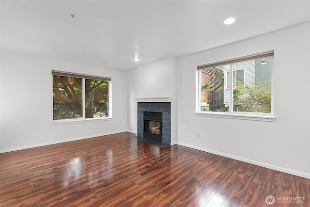 232 Belmont Ave E # 201, Seattle, WA 98102 - unfurnished living room featuring a fireplace with flush hearth, wood finished floors, and recessed lighting