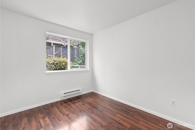 232 Belmont Ave E # 201, Seattle, WA 98102 - spare room with baseboard heating and dark wood-style floors
