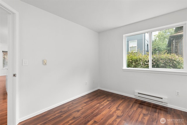 232 Belmont Ave E # 201, Seattle, WA 98102 - spare room with a baseboard radiator and dark wood-style flooring