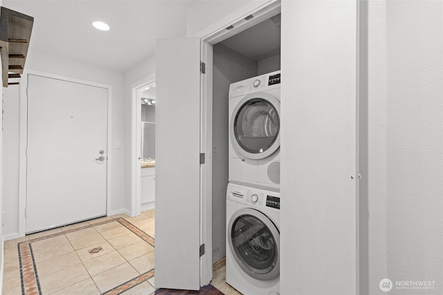 232 Belmont Ave E # 201, Seattle, WA 98102 - laundry room featuring stacked washer / dryer, light tile patterned floors, and recessed lighting