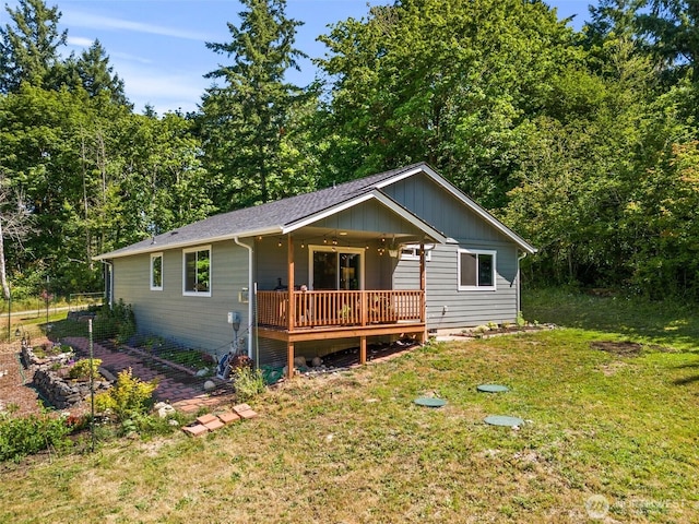 5843 Octave Ct SE, Olympia, WA 98513 - view of front of home featuring a front yard, board and batten siding, and a wooden deck