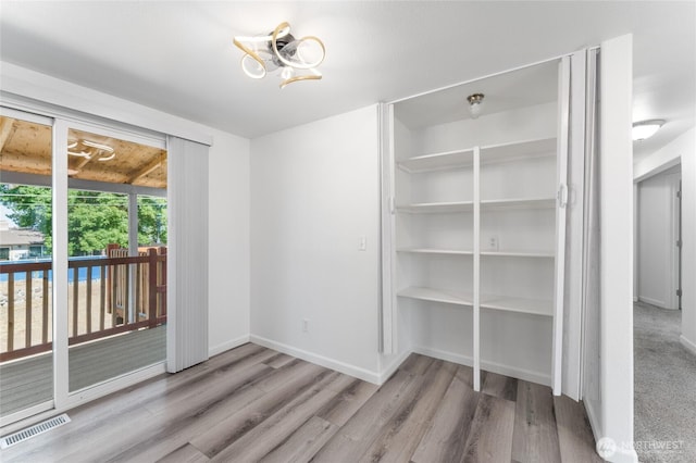 2112 S Crestmont Dr, Moses Lake, WA 98837 - unfurnished dining area with wood finished floors and a chandelier