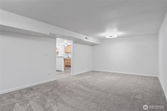 2112 S Crestmont Dr, Moses Lake, WA 98837 - finished below grade area with light colored carpet and a sink