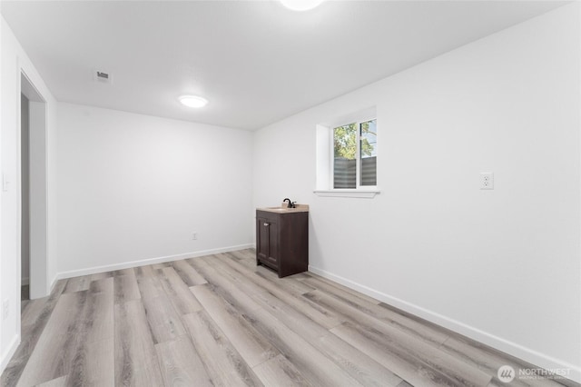 2112 S Crestmont Dr, Moses Lake, WA 98837 - spare room featuring light wood-type flooring and baseboards