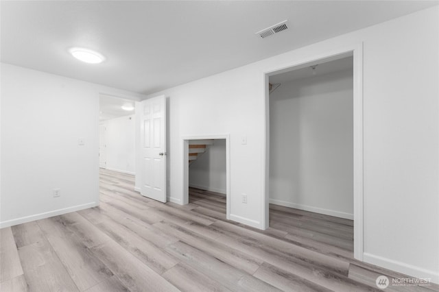 2112 S Crestmont Dr, Moses Lake, WA 98837 - unfurnished bedroom featuring wood finished floors and a spacious closet