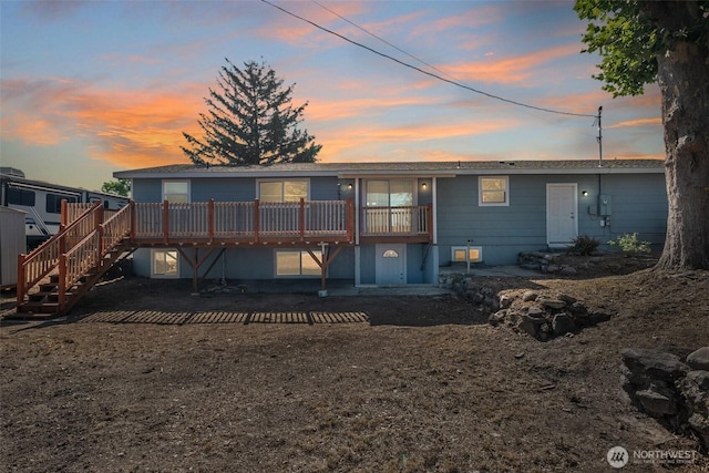 2112 S Crestmont Dr, Moses Lake, WA 98837 - back of house at dusk with a deck and stairway
