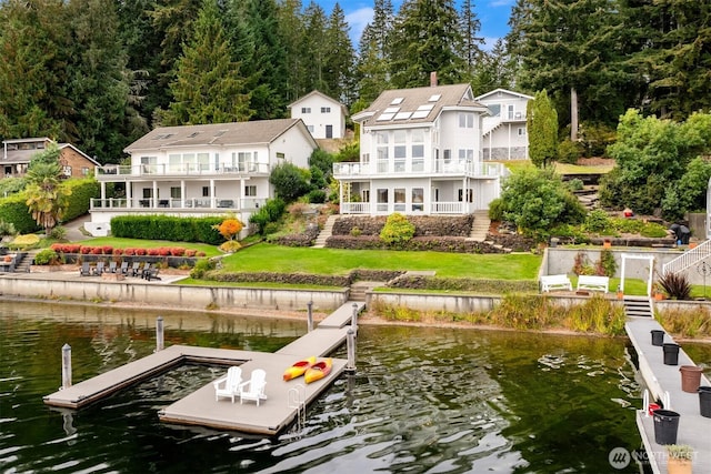 2210 E Mason Lake Dr W, Grapeview, WA 98546 - dock area with a water view, a balcony, a lawn, and stairway