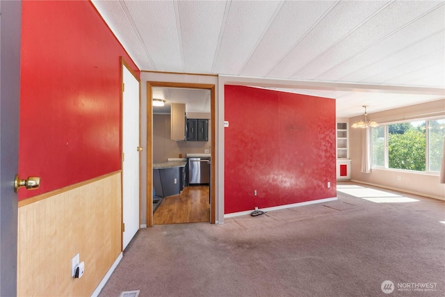 7138 Englewood Dr SE Unit 32, Olympia, WA 98513 - spare room featuring carpet floors and a chandelier