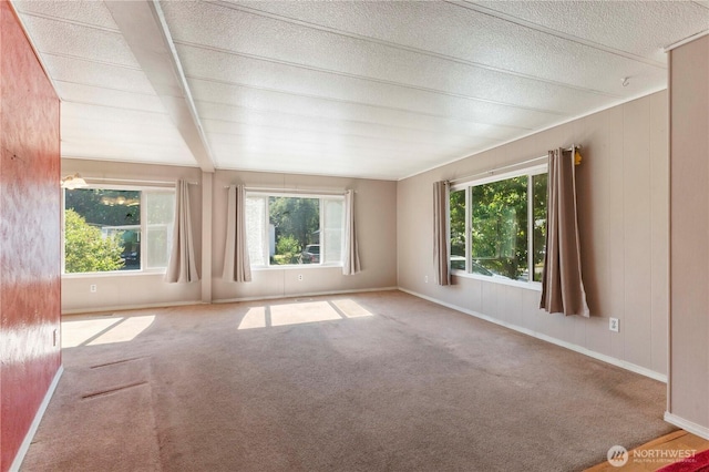7138 Englewood Dr SE Unit 32, Olympia, WA 98513 - carpeted spare room featuring baseboards and beamed ceiling