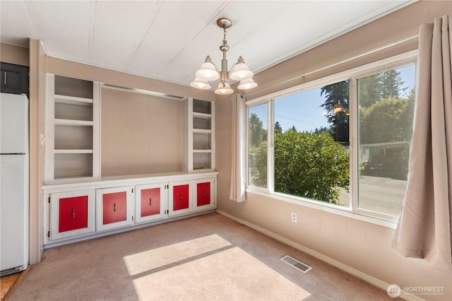 7138 Englewood Dr SE Unit 32, Olympia, WA 98513 - interior space featuring healthy amount of natural light, a chandelier, and built in shelves