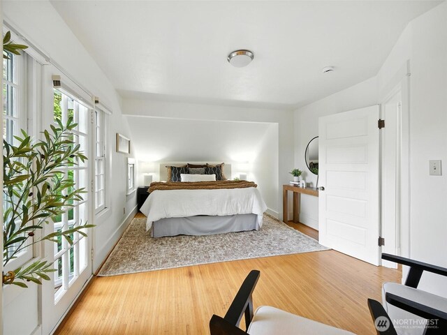 2555 Queen Anne Ave N, Seattle, WA 98109 - bedroom with wood finished floors and baseboards