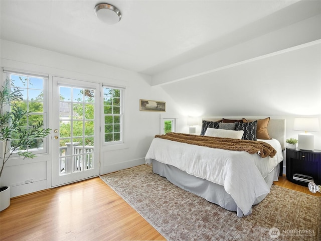 2555 Queen Anne Ave N, Seattle, WA 98109 - bedroom featuring access to exterior and wood finished floors