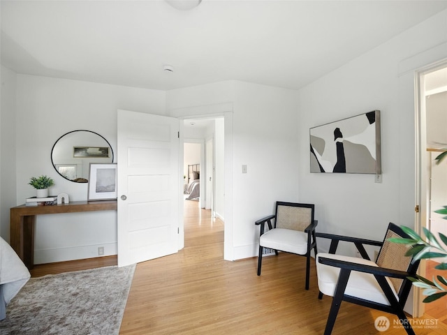2555 Queen Anne Ave N, Seattle, WA 98109 - sitting room with light wood-style floors and baseboards