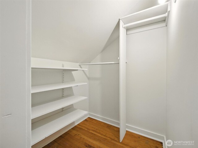 2555 Queen Anne Ave N, Seattle, WA 98109 - spacious closet featuring wood finished floors and vaulted ceiling