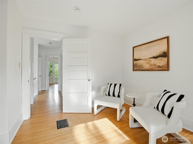 2555 Queen Anne Ave N, Seattle, WA 98109 - sitting room with light wood-style flooring and baseboards
