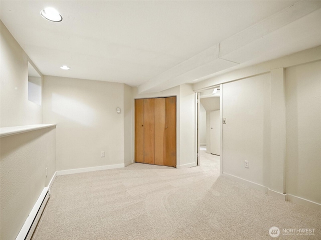 2555 Queen Anne Ave N, Seattle, WA 98109 - finished basement featuring a baseboard heating unit, carpet flooring, and recessed lighting