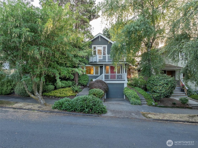 2555 Queen Anne Ave N, Seattle, WA 98109 - view of property hidden behind natural elements featuring a balcony and asphalt driveway