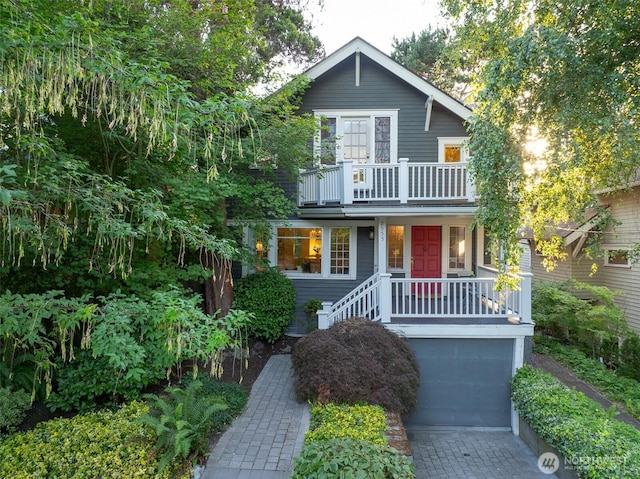 2555 Queen Anne Ave N, Seattle, WA 98109 - view of front of home with a balcony, driveway, and an attached garage