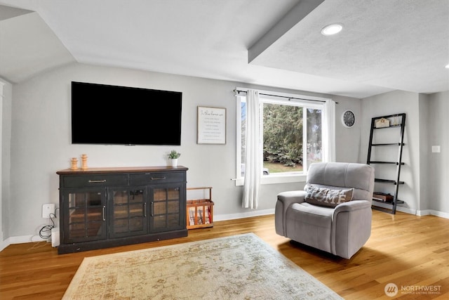 2819 W Olympic Ave, Spokane, WA 99205 - living area with wood finished floors, recessed lighting, and vaulted ceiling