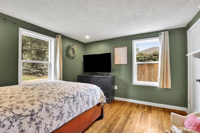 2819 W Olympic Ave, Spokane, WA 99205 - bedroom with hardwood / wood-style flooring, a textured ceiling, and recessed lighting