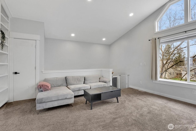 2819 W Olympic Ave, Spokane, WA 99205 - living room with radiator heating unit, carpet floors, recessed lighting, and vaulted ceiling