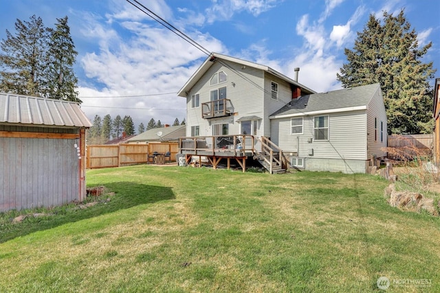 2819 W Olympic Ave, Spokane, WA 99205 - rear view of house featuring a fenced backyard, a wooden deck, and a shed