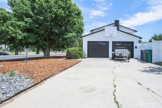1609 Russell St, Wenatchee, WA 98801 - view of property exterior with a chimney and a garage