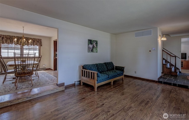 1609 Russell St, Wenatchee, WA 98801 - living area featuring wood finished floors, a chandelier, and stairway