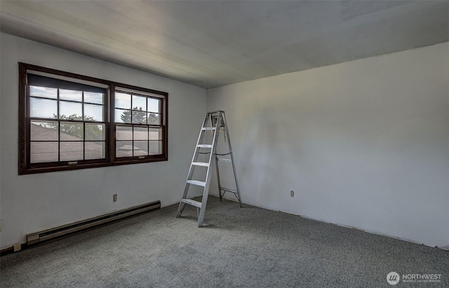 1609 Russell St, Wenatchee, WA 98801 - carpeted empty room with a baseboard heating unit