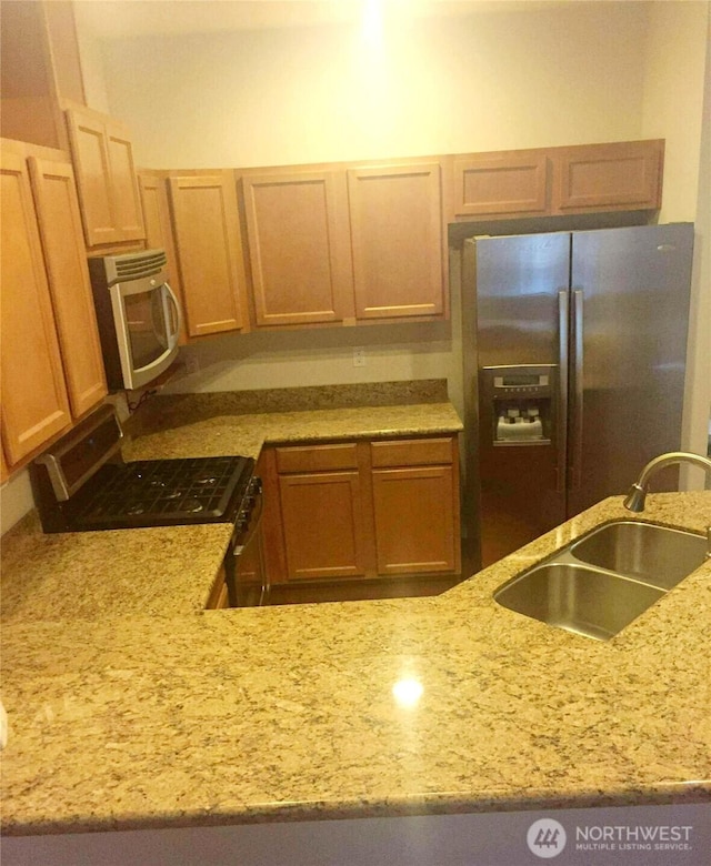 1317 52nd St NE Unit 1304, Auburn, WA 98002 - kitchen with stainless steel appliances and light stone countertops